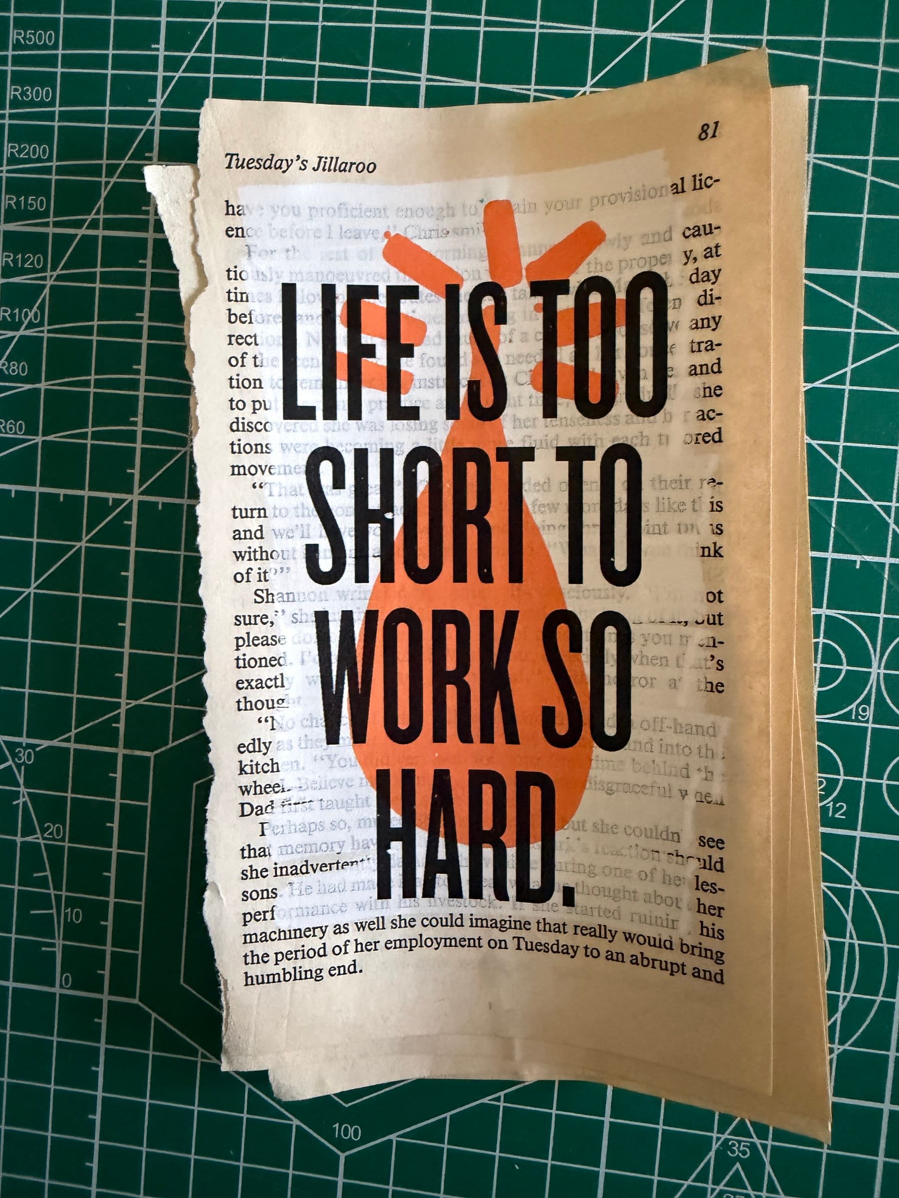 LIFE IS TOO SHORT TO WORK SO HARD: black display caps overprinted on an orange watercolor block with two small accent crosses, on a torn paperback page