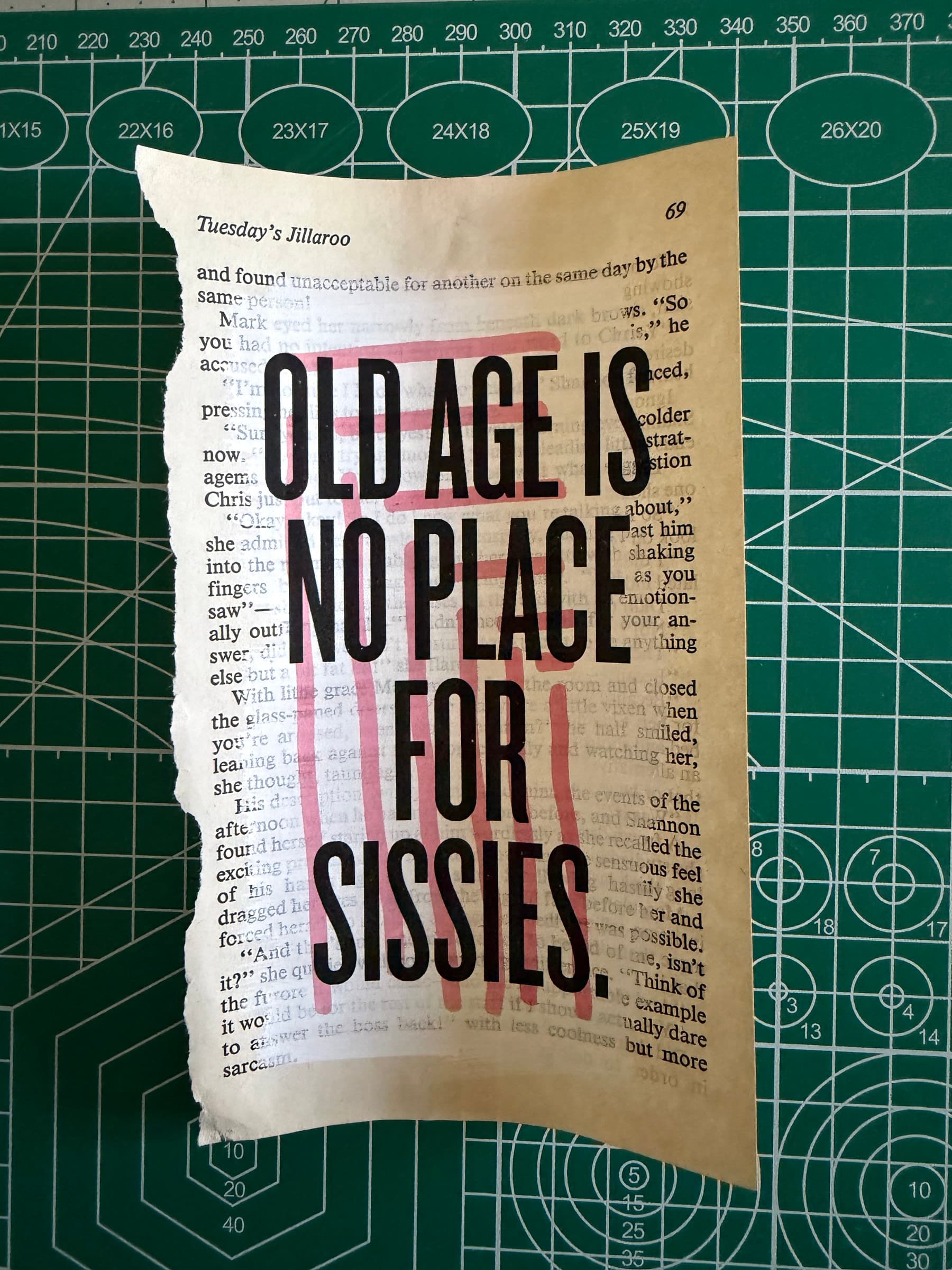 OLD AGE IS NO PLACE FOR SISSIES: black display caps overprinted on a series of pale red horizontal watercolor strokes